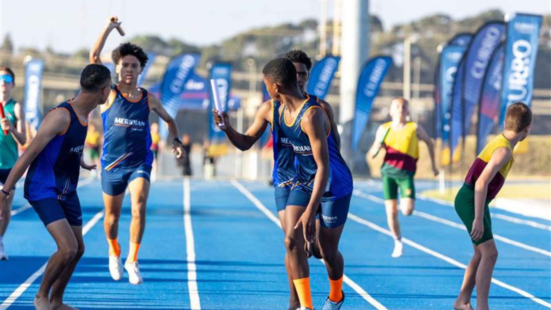 Relay changeover at the Curro Podium athletics series