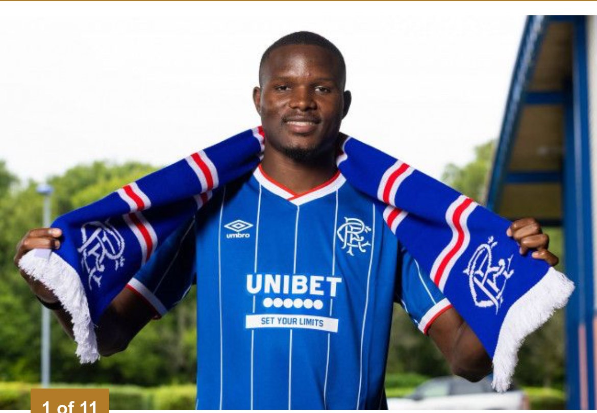 Olwethu Makhanya holds up a Rangers scarf at his unveiling