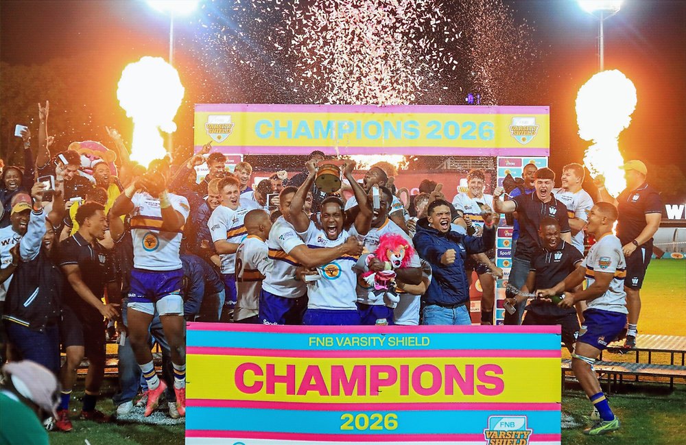 Wits players lift the FNB Varsity Shield trophy, 2026